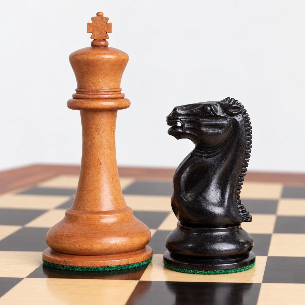 1849 Cooke Staunton Chess Set Combo with Ebony & Antiqued Boxwood Pieces, Board and Storage Box - king and knight close-up