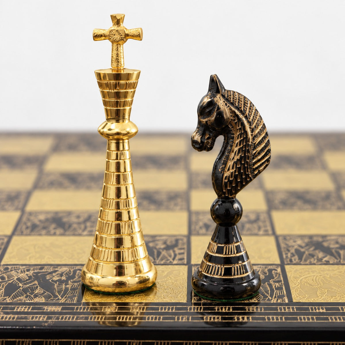 Luxury Solid Brass Chess Set with Tribal Artwork Pieces & Board - Black & Gold, 12-Inch - king and knight close-up